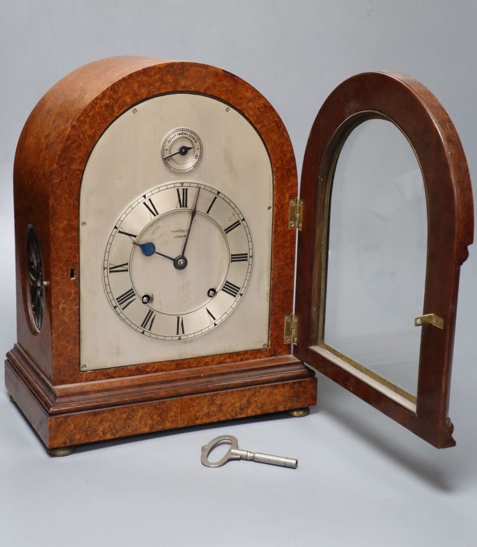 An Edwardian eight day birds eye maple cased mantel clock, with chiming movement, retailed by Harrods, 31cm high